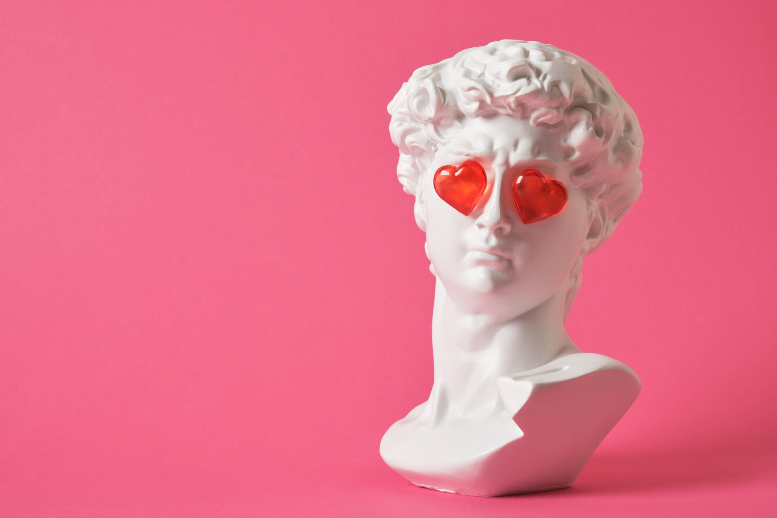 fake,bust,of,david,with,red,glass,hearts,on,the