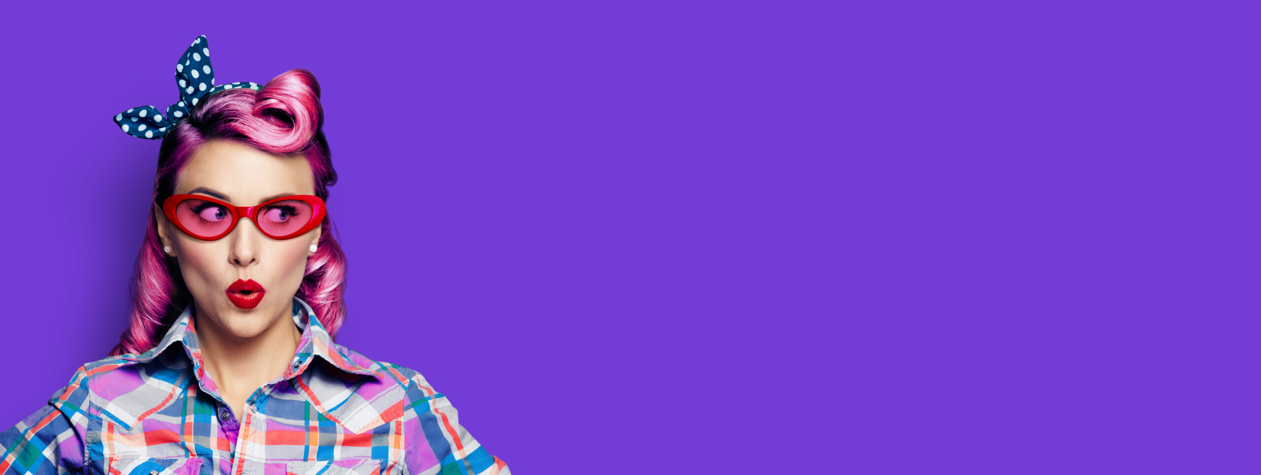 excited,surprised,woman.,pinup,girl,in,red,glasses,looking,sideways.