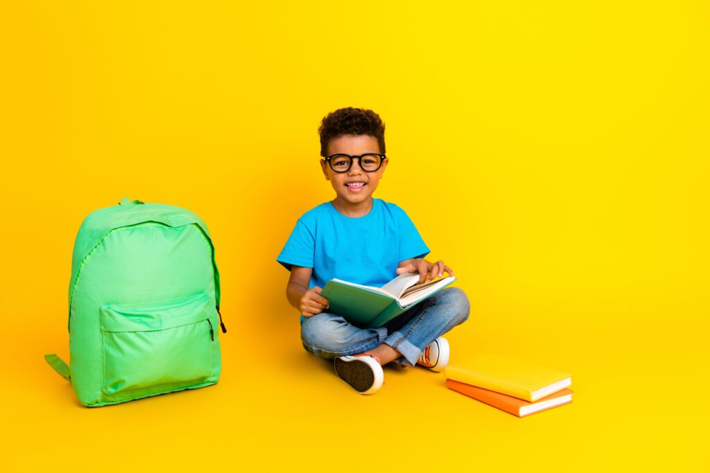 full,length,photo,of,smart,cheerful,preteen,boy,wear,blue